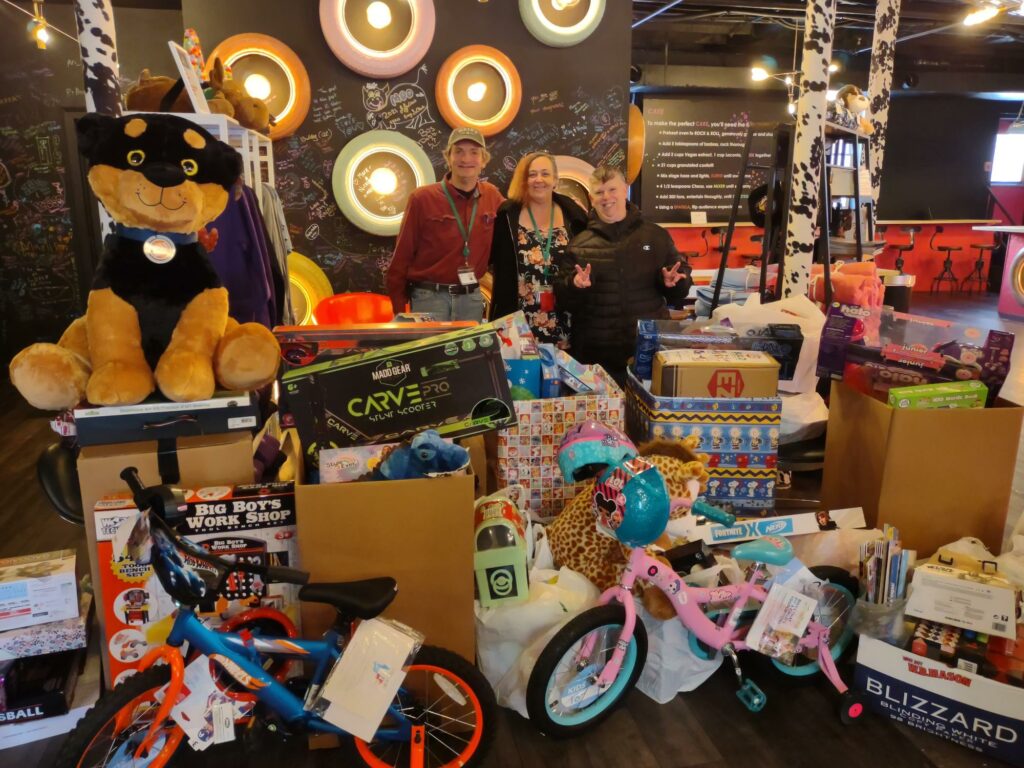 photo featuring a large number of toys that were donated as part of our holiday toy drive, including bicycles, games, and stuffed animals