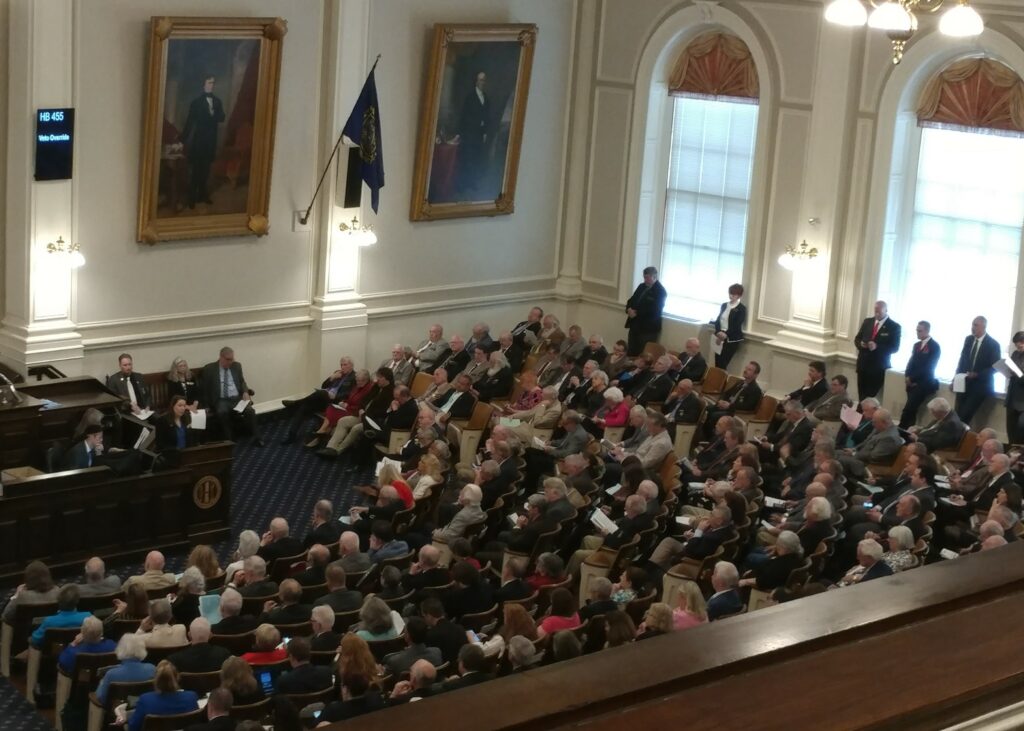 Photo of the NH House of Representatives meeting in the House chamber, pre-COVID.